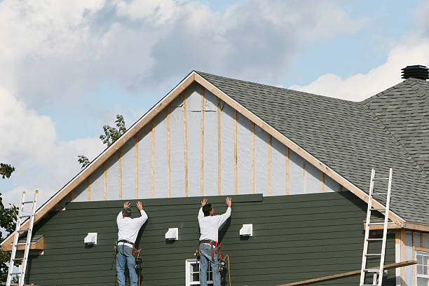 Professional Siding Installation technician working in Gold Hill, OR
